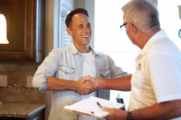 happy-home-owner-shaking-contractors-hand