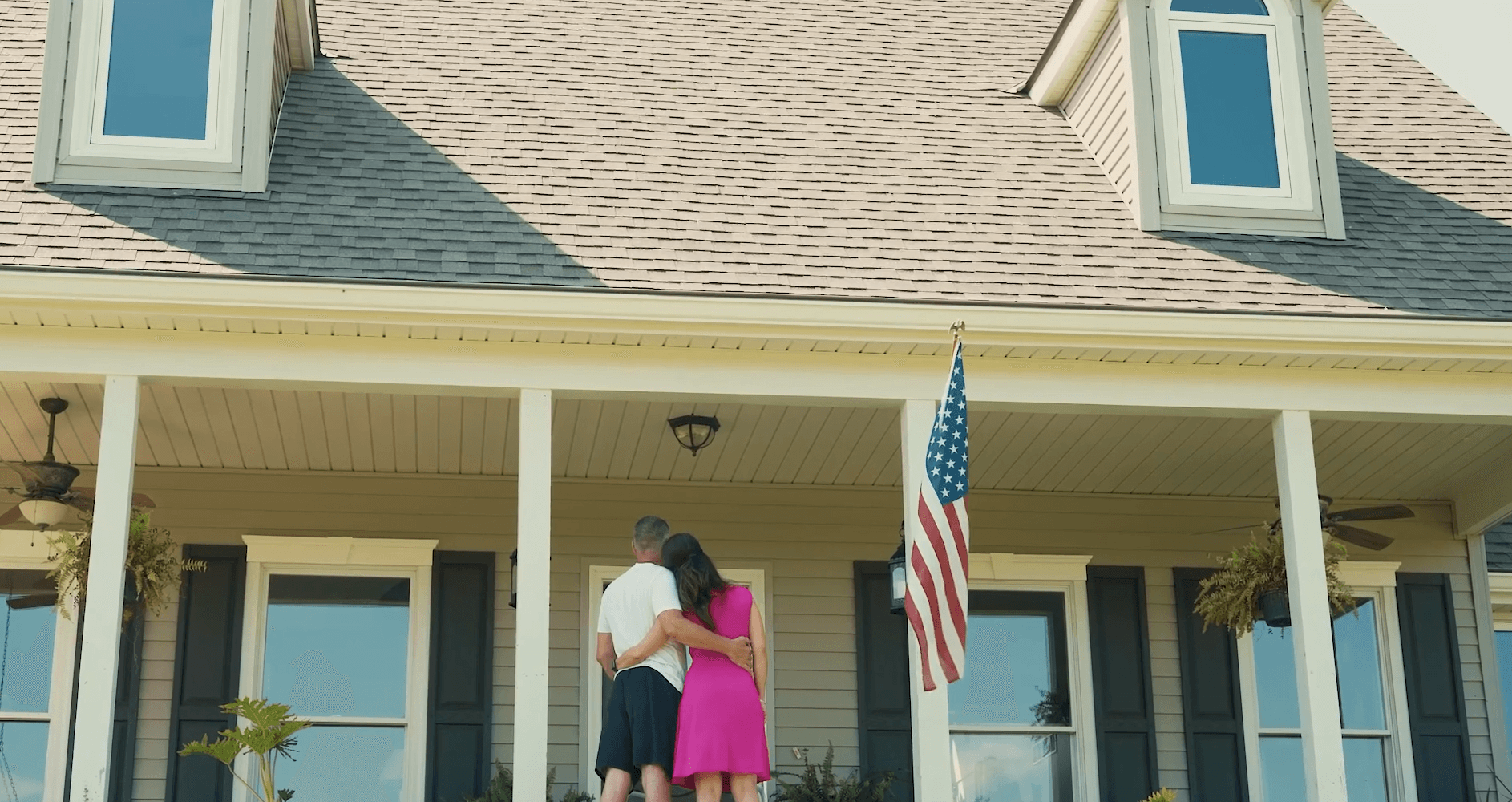 couple front of house porch